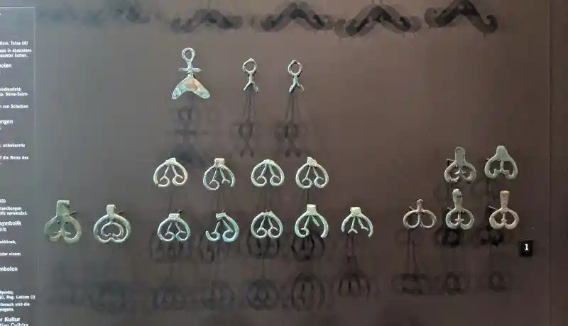 Anthropomorphic bronze pendants representing abstract deities and amulets from the Central European Bronze Age (16th-12th century BCE)